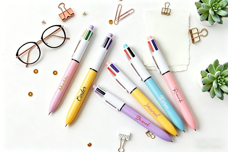 May include: A white ceramic mug with a black handle and the text "But First, Coffee" in a bold, black font. The mug is set against a blurred background, suggesting a cozy setting.