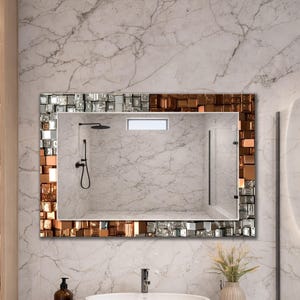Este espejo presenta un diseño estilo mosaico (vidrio impreso), no mosaicos reales.