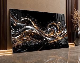 May include: A rectangular wall art piece featuring a high-gloss black background with abstract, flowing ribbons of metallic gold and silver. The composition includes scattered spherical accents and granular textures that create a sense of depth and movement.
