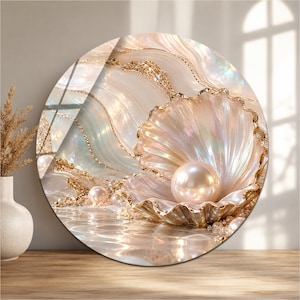 May include: A circular wall art piece featuring an iridescent seashell holding a large, lustrous pearl. The design incorporates flowing, wave-like patterns in shades of cream, soft pink, and gold, with shimmering gold accents throughout the composition.