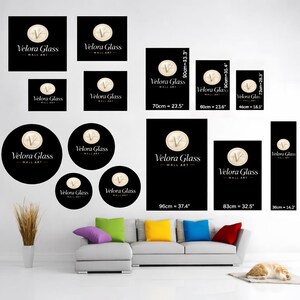May include: A collection of black wall art pieces with the text "Velora Glass - Wall Art". The art features a gold emblem with the letter "V". Various sizes are displayed, including 36 inches, 32.5 inches, and 37.4 inches.