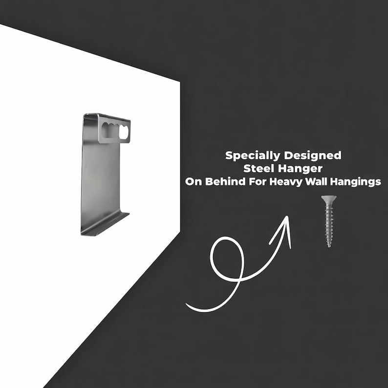 May include: A silver-colored steel hanger with a flat rectangular body and a top section featuring two oval cutouts, accompanied by a single metal screw. The text reads: Specially Designed Steel Hanger On Behind For Heavy Wall Hangings.