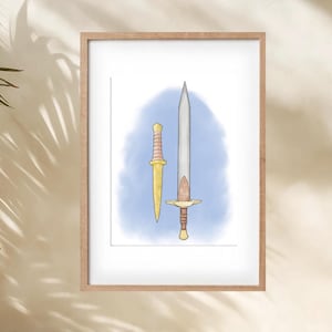 May include: Framed artwork featuring a watercolor illustration of a sword and a dagger. The sword has a silver blade and a brown and gold hilt. The dagger is gold with a ridged handle. The background is a light blue wash.