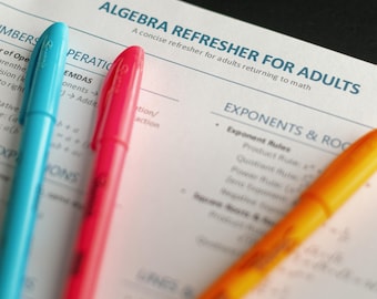 May include: Close-up of a worksheet titled "ALGEBRA REFRESHER FOR ADULTS" with blue, red, and orange pens. The worksheet covers topics like exponents and roots. A paper clip is visible at the top.