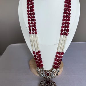 Victorian style ruby layered long haram with earrings.