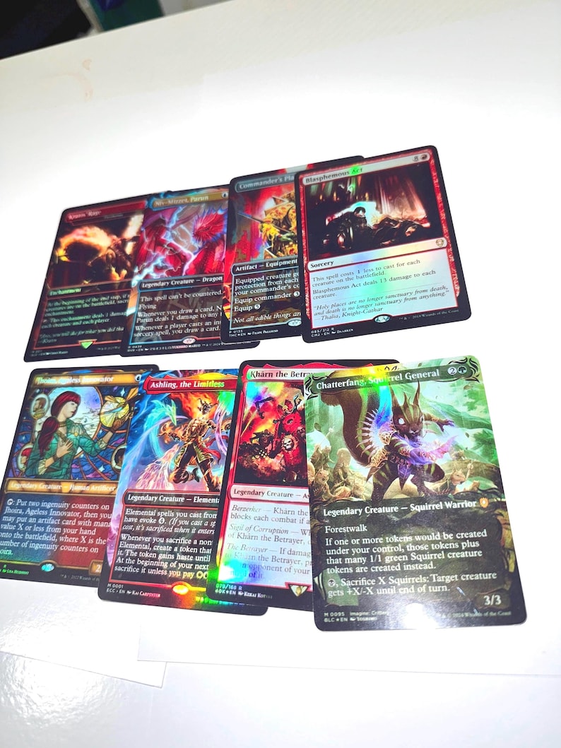 May include: A collection of Magic: The Gathering trading cards. The cards feature colorful illustrations of fantasy creatures and spells. The cards are in various conditions and feature different card types, including creatures, sorceries, and artifacts.