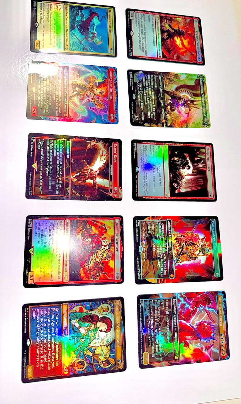 May include: A collection of Magic: The Gathering trading cards, featuring various characters and artwork. The cards display vibrant colors, holographic foil, and text descriptions. The cards are rectangular and have a glossy finish.