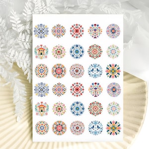 May include: A rectangular sheet of stickers featuring thirty circular designs arranged in six rows and five columns. The patterns include colorful floral mandalas, small houses, and pairs of birds in shades of red, blue, yellow, and green.