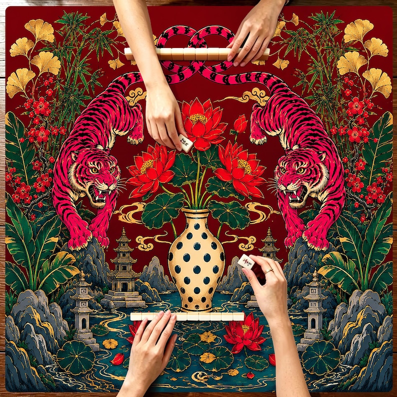 May include: A square mahjong mat featuring a deep red background with two symmetrical pink tigers, a central cream-colored vase with black polka dots, red lotus flowers, green foliage, and traditional pagoda structures in a landscape setting.