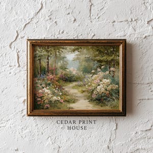 Puede incluir: Pintura enmarcada de un paisaje con un camino que serpentea por un bosque exuberante con flores coloridas. La obra de arte tiene un marco dorado y el texto "CEDAR PRINT HOUSE" en la parte inferior.