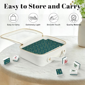 May include: White zippered case with a clear top, open to reveal a teal and gold patterned interior. The case is labeled "Easy to Store and Carry" and includes icons for easy carry, light weight, smooth touch, and quality material. Several mahjong tiles are scattered around the case.