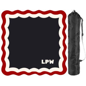 May include: A navy blue mat with a scalloped red and white border, and the initials "LPW" in white. A black carrying bag with a shoulder strap is next to the mat. The mat is likely for yoga or exercise.