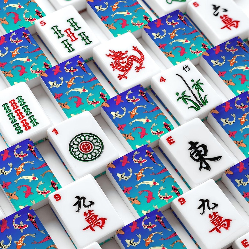 May include: A collection of white Mahjong tiles with various symbols and numbers. The tiles are arranged in a grid pattern, with a blue and teal koi fish design on the back of each tile. Some tiles feature red dragons, bamboo, and other symbols.