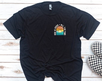 May include: Black t-shirt with a graphic design of a sunset with the text "Good is good all the time".