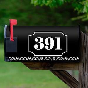 May include: Black mailbox with a white number 391 on a black background with a white decorative border. The mailbox is mounted on a wooden post.