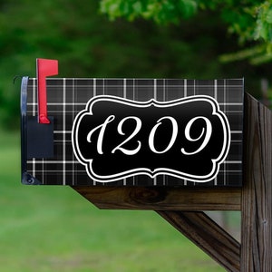 May include: Black and white plaid mailbox with a white number plaque that says "1209".