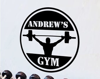May include: Black and white gym decal with the text "ANDREW'S GYM" and a silhouette of a person lifting a barbell.