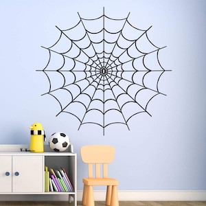 Peut inclure: Autocollant mural en forme de toile d'araignée noire, un grand motif circulaire avec un point central, parfait pour la décoration d'Halloween.