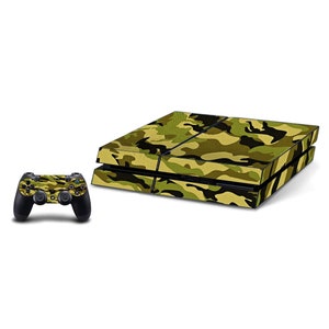 May include: A camouflage-patterned skin for a PlayStation 4 console and controller. The console skin is green, brown, and black, while the controller skin is green and brown.