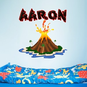 May include: A blue bed with red storage bins underneath. The wall behind the bed has a red and black volcano decal with the name "AARON" above it.