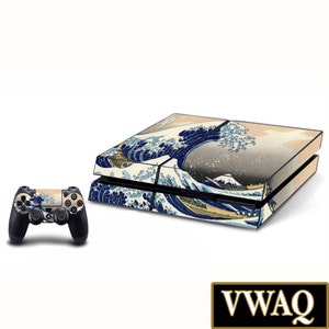 May include: A blue and white video game console skin featuring a Japanese wave design. The skin is applied to a black PlayStation 4 console. The console is shown with a matching controller.