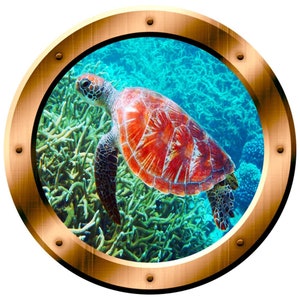 May include: A red and orange sea turtle swims through a vibrant blue and green coral reef. The turtle is seen through a round porthole with a gold metal frame.