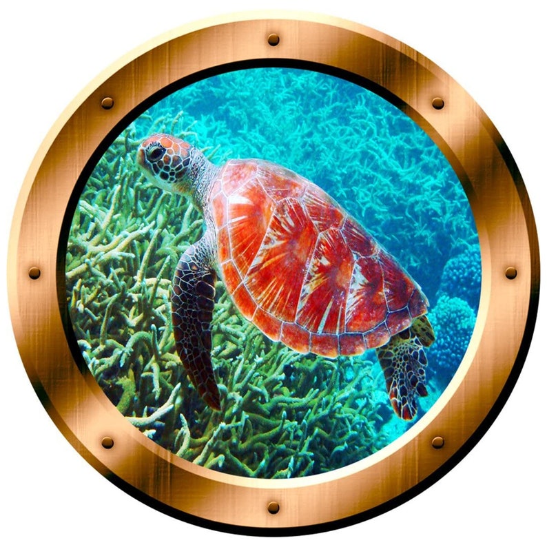 May include: A red and orange sea turtle swims through a vibrant blue and green coral reef. The turtle is seen through a round porthole with a gold metal frame.