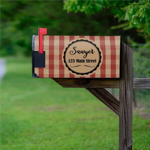 May include: Red and white checked mailbox with a brown label that says "Sawyer 123 Main Street".
