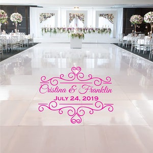 May include: A pink wedding dance floor sticker with a decorative border and the text "Cristina & Franklin JULY 24, 2019".