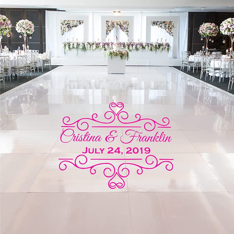 May include: A pink wedding dance floor sticker with a decorative border and the text "Cristina & Franklin JULY 24, 2019".