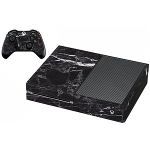 May include: Black and white marble skin decal for an Xbox One console and controller. The decal features a realistic marble pattern.
