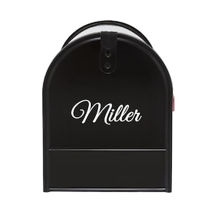 May include: Black mailbox with a white cursive name "Miller" on the front.