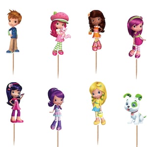 May include: A set of twelve Strawberry Shortcake themed cupcake toppers featuring various animated characters and a logo sign. Each character is printed on cardstock and attached to a wooden toothpick, showcasing vibrant colors and distinct outfits.