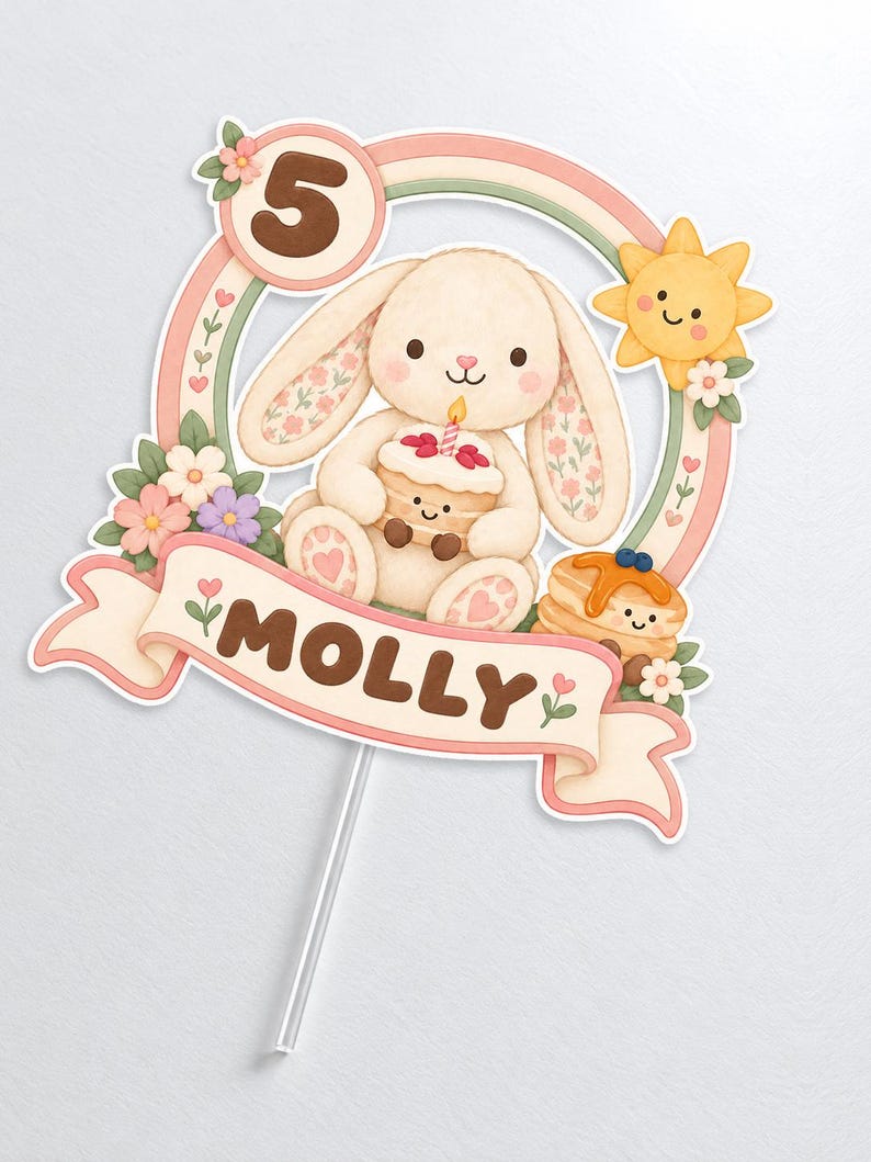 May include: A cake topper featuring a cream-colored bunny holding a small cake, a yellow sun, flowers, and a rainbow arch. The number 5 is displayed in a circle, and a banner at the bottom features the name MOLLY in brown letters on a light pink background.