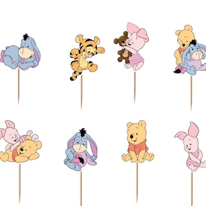 May include: A set of twelve decorative cupcake toppers featuring colorful illustrations of Winnie the Pooh, Piglet, Tigger, and Eeyore in various poses. One topper shows Pooh in a honey pot with the word Hunny printed on the front.
