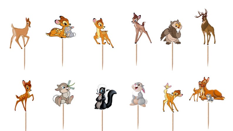 May include: A set of twelve decorative cupcake toppers featuring various cartoon forest animals including deer, a rabbit, a skunk, an owl, and a stag, each attached to a thin wooden pick for insertion into food items for themed party displays.