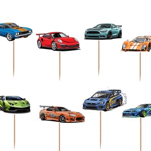 May include: A collection of twelve decorative cupcake toppers featuring various sports cars, gold trophies, and crossed checkered racing flags. Each illustration is mounted on a thin wooden pick, showcasing vibrant colors and detailed car designs.