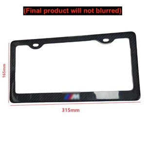 May include: A black license plate frame with a carbon fiber texture. The frame is rectangular with rounded corners and two mounting holes. The dimensions are 165mm x 315mm. The text "(Final product will not blurred)" is at the top.