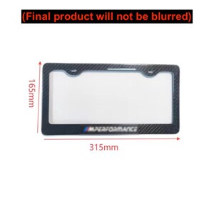 May include: A rectangular license plate frame with a carbon fiber pattern. The frame measures 315mm long and 165mm high. The text "M PERFORMANCE" is visible at the bottom. The text at the top says "(Final product will not be blurred)".
