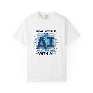 May include: White t-shirt with a blue graphic that reads "REAL WORLD AI - LEARN AND EARN - WITH AI". The design features the letters "AI" in a bold, stylized font, surrounded by a circuit board design.