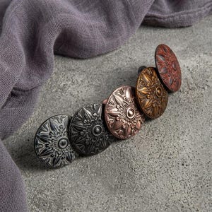 May include: A rustic wooden sign with the text "Welcome to our home" in white lettering. The sign features a distressed finish and a simple, inviting design, perfect for front door decor.