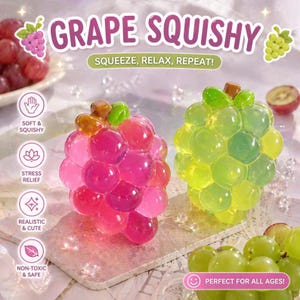 May include: Two grape-shaped squishy toys, one pink and one green, with the text "GRAPE SQUISHY" above them. The text "SQUEEZE, RELAX, REPEAT!" is also visible. Additional text includes "SOFT & SQUISHY", "STRESS RELIEF", "REALISTIC & CUTE", "NON-TOXIC & SAFE", and "PERFECT FOR ALL AGES!"