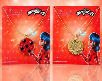 May include: Two gold-tone necklaces on red display cards featuring the Miraculous Ladybug character. One pendant is a red circular ladybug with black spots, and the other is a gold circular charm embossed with the text LUCKY CHARM and two bees.