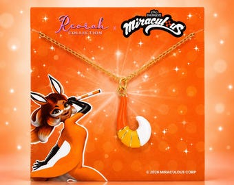 May include: A gold-toned chain necklace featuring a fox tail pendant with orange, yellow, and white enamel segments. The necklace is displayed on an orange card with the text Reorah Collection and Miraculous, featuring a cartoon fox character illustration.