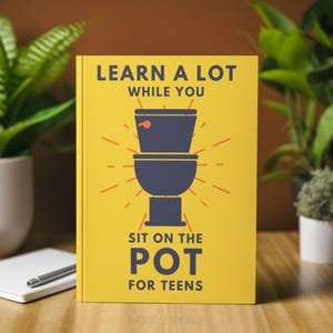 May include: A yellow book with the text "LEARN A LOT WHILE YOU SIT ON THE POT FOR TEENS" and a navy blue toilet illustration. The book is on a wooden surface, with plants and a notepad in the background.