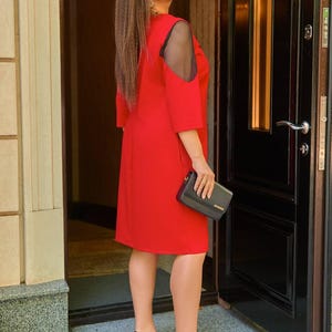 Side view of red plus size midi dress with sheer sleeves, formal evening dress for curvy women
