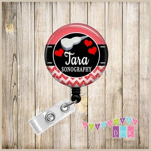 May include: Red and black badge reel with a white ultrasound probe, three red hearts, and the text "Tara Sonography".
