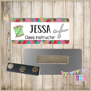May include: A colorful name tag with a patchwork design featuring a sewing needle and thread, scissors, and the text "Jessa Class Instructor". The name tag is attached to a silver magnetic name tag holder.