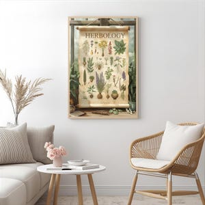 May include: A framed botanical print titled "Herbology" featuring various plant illustrations. The print has a vintage aesthetic with a light brown background and a wooden frame. The print is displayed in a well-lit room with a white sofa, a round table, and a wicker chair.