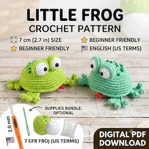 May include: A digital crochet pattern for a little frog, featuring two finished green crocheted frogs with white eyes. The image includes text: LITTLE FROG CROCHET PATTERN, 7 cm (2.7 in) SIZE, BEGINNER FRIENDLY, and US TERMS. Includes a 2.0 mm crochet hook.
